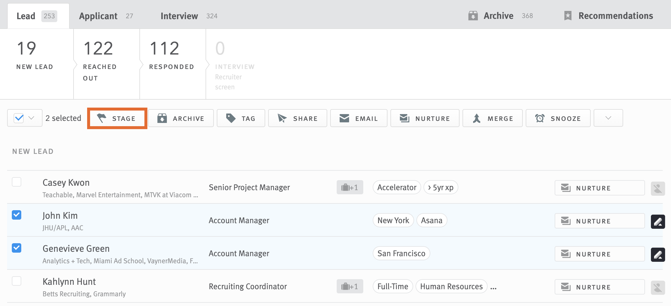 Two opportunities selected in opportunity list; Stage button in bulk action toolbar outlined for emphasis.