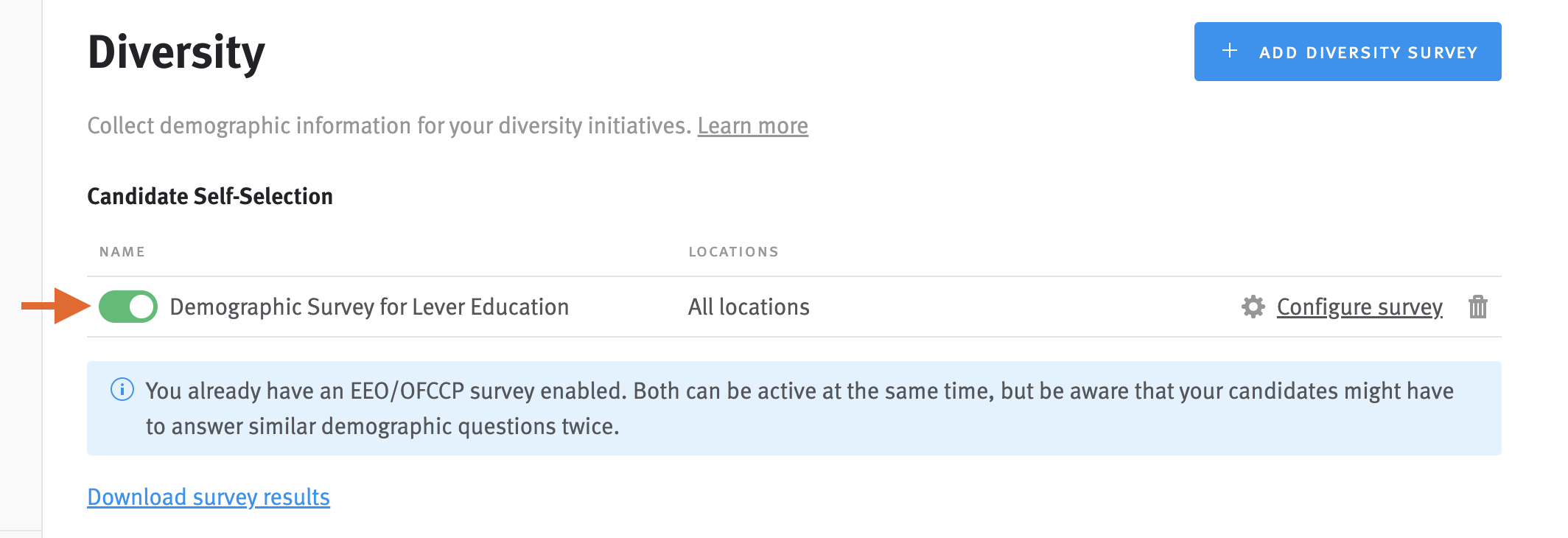 Surveys settings page with arrow pointing to green toggle in the diversity surveys section
